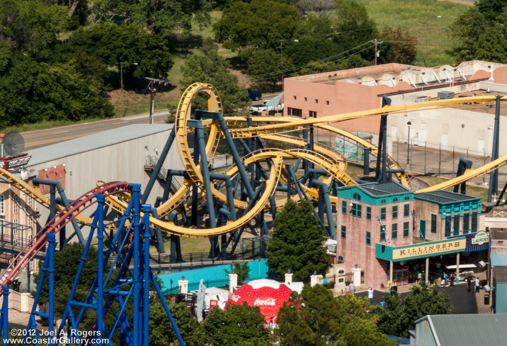 Aerial view of a yellow inverted roller coaster in Texas