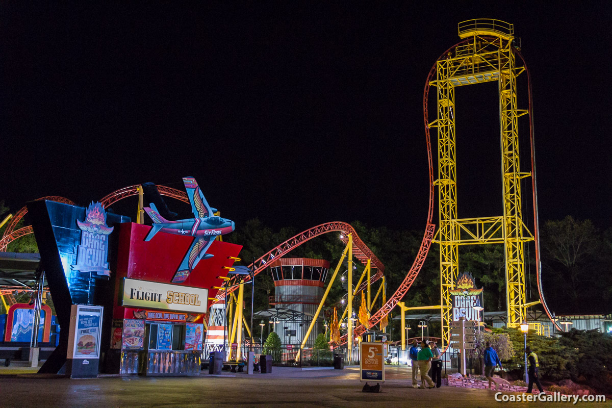 A modern steel roller coaster in the darkness of night