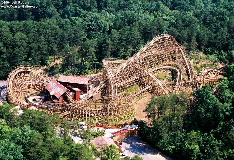 Helicopter view of a twisted wooden roller coaster
