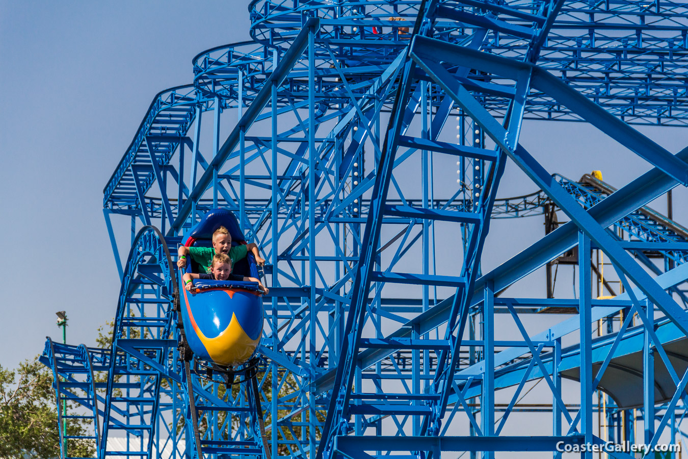 Two kids riding the Cyclone roller coaster at the Wonderland Park