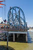 Roller coaster and amusement park on a pier over the Gulf of Mexico