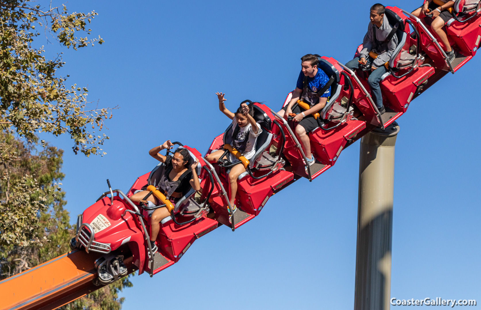 Straddling the rail of a single-rail roller coaster