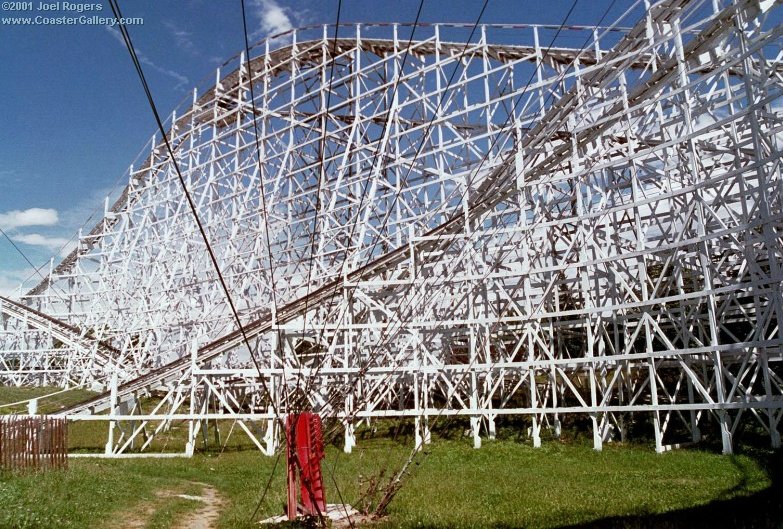 Wooden roller coaster structure and steel support cables