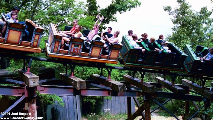 Riders facing forward and backward on a roller coaster