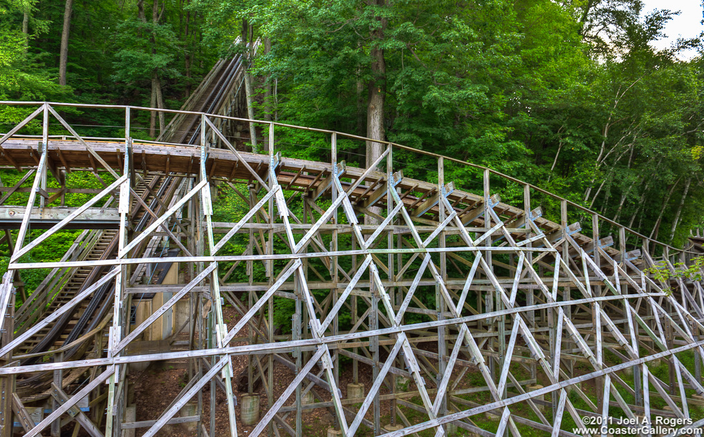 The Boulder Dash lift hill surrounded by trees