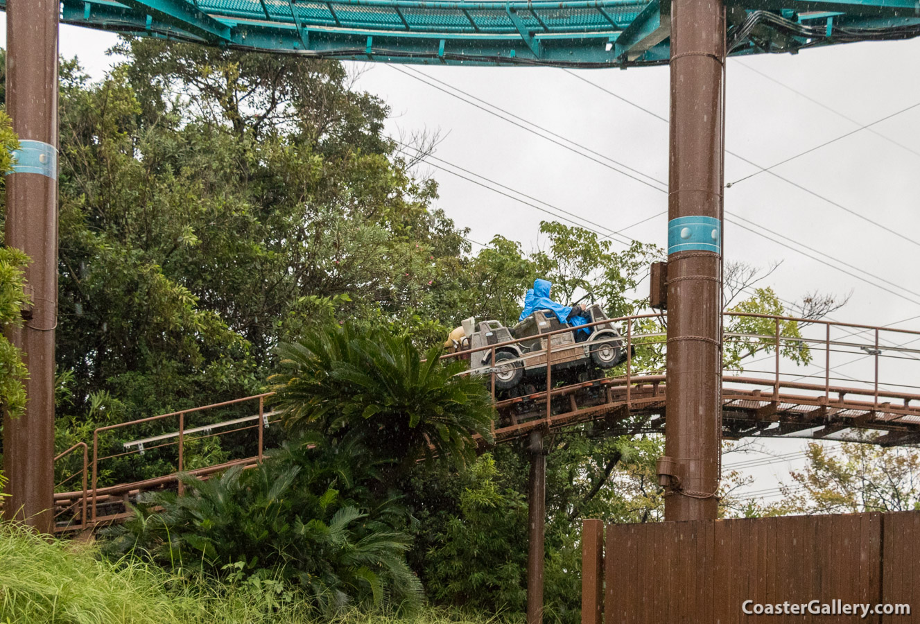 A picture of a Japanese roller coaster going up a lift hill