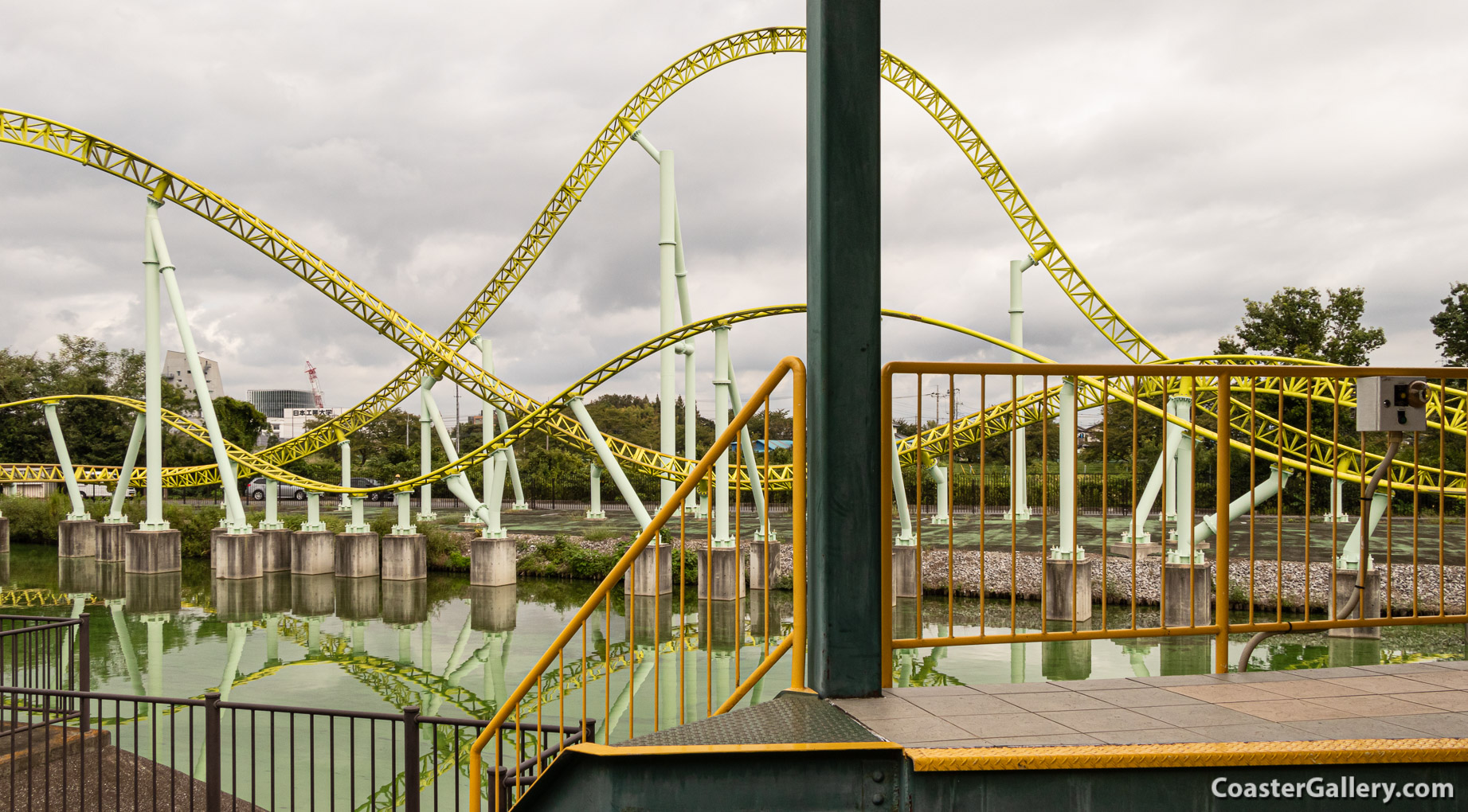 A lake and the Kawasemi roller coaster at the Tobu Zoo in Japan